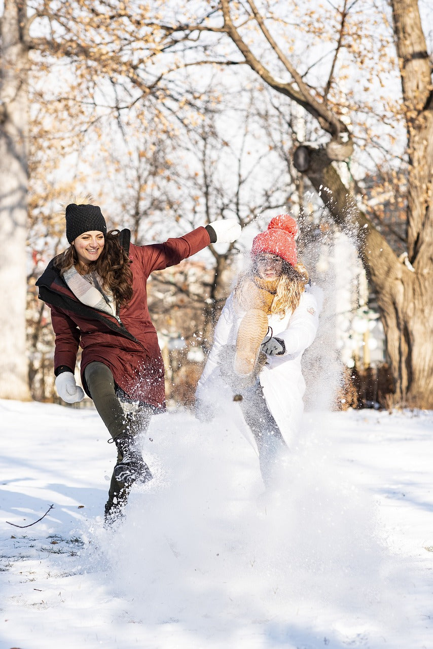 Women playing in the snow.